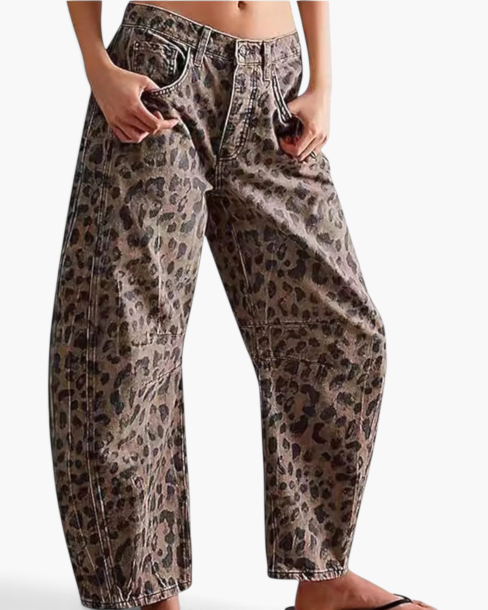 Beach Rose Co. relaxed barrel leg jeans in a brown leopard print cotton blend with knee darts and curved seams.