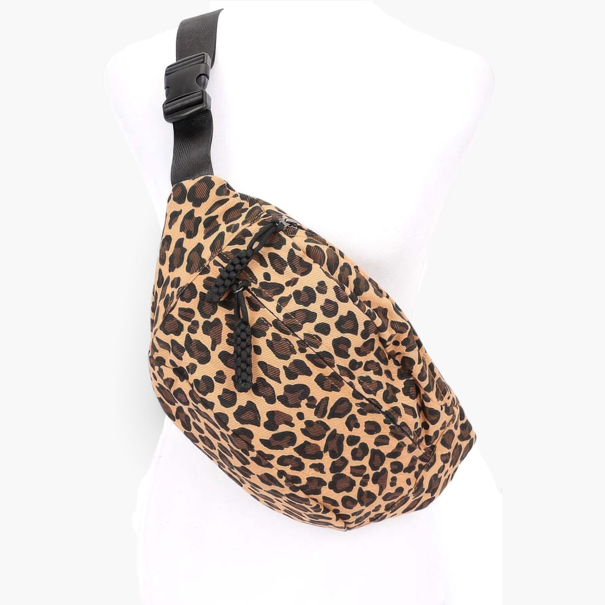 Beach Rose Co. leopard print cotton canvas crossbody bag with an adjustable black strap on a white mannequin