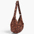 Beach Rose Co. leopard print faux suede crossbody bag with double front pockets and an adjustable shoulder strap.