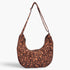 Beach Rose Co. leopard print faux suede crossbody bag with two front pockets and an adjustable shoulder strap.