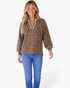 Beach Rose Co. camel and black leopard print pullover with a V-neckline, striped ribbed trim, and balloon sleeves.