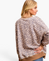 Beach Rose Co. taupe leopard print long sleeve sweatshirt with brown contrast trim and a relaxed layered-look fit.