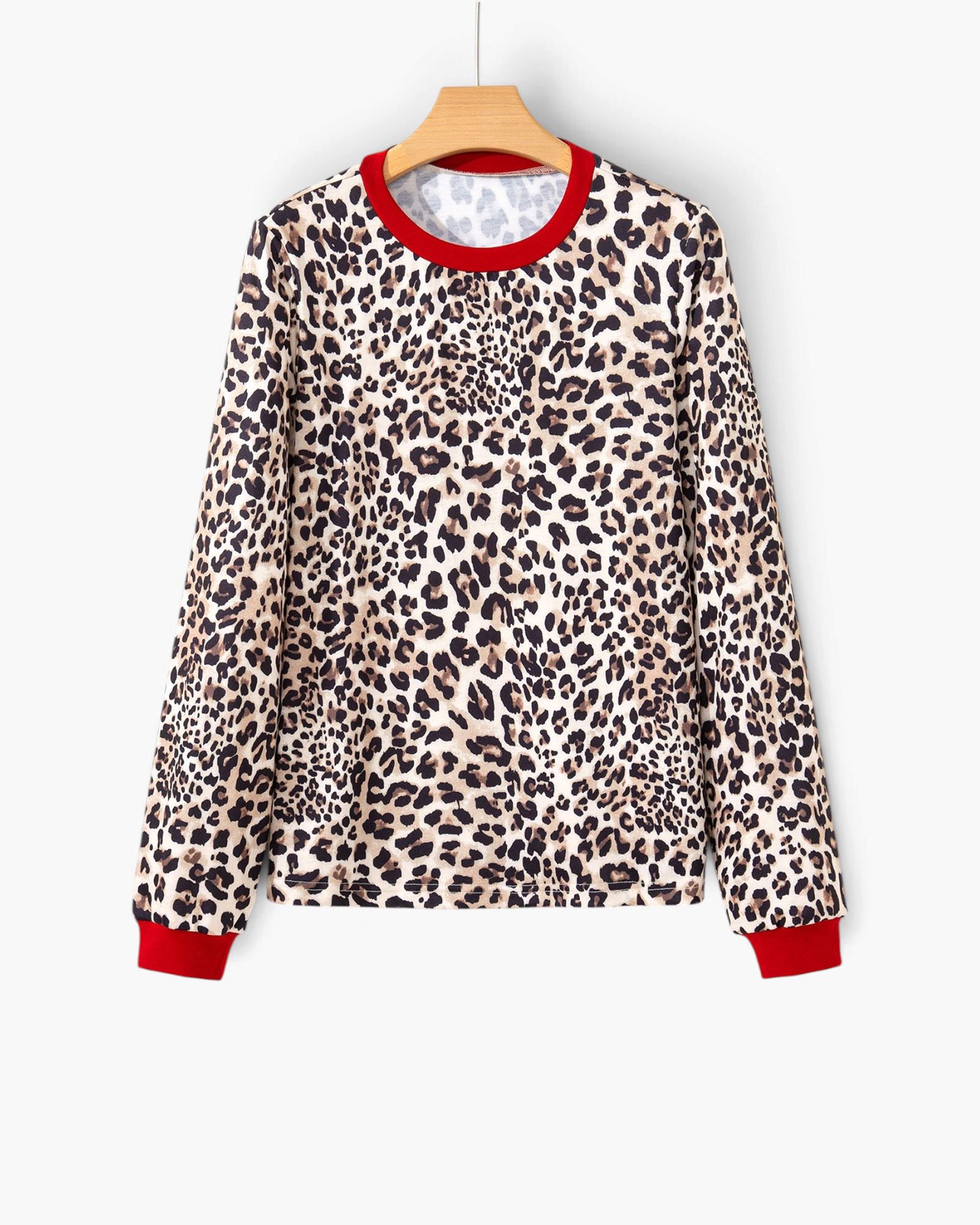 Beach Rose Co. long sleeve top in tan and black leopard print with contrasting red crew neckline and sleeve cuffs.