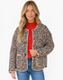 Beach Rose Co. beige and black leopard print quilted jacket with a collarless snap-front and patch pockets.