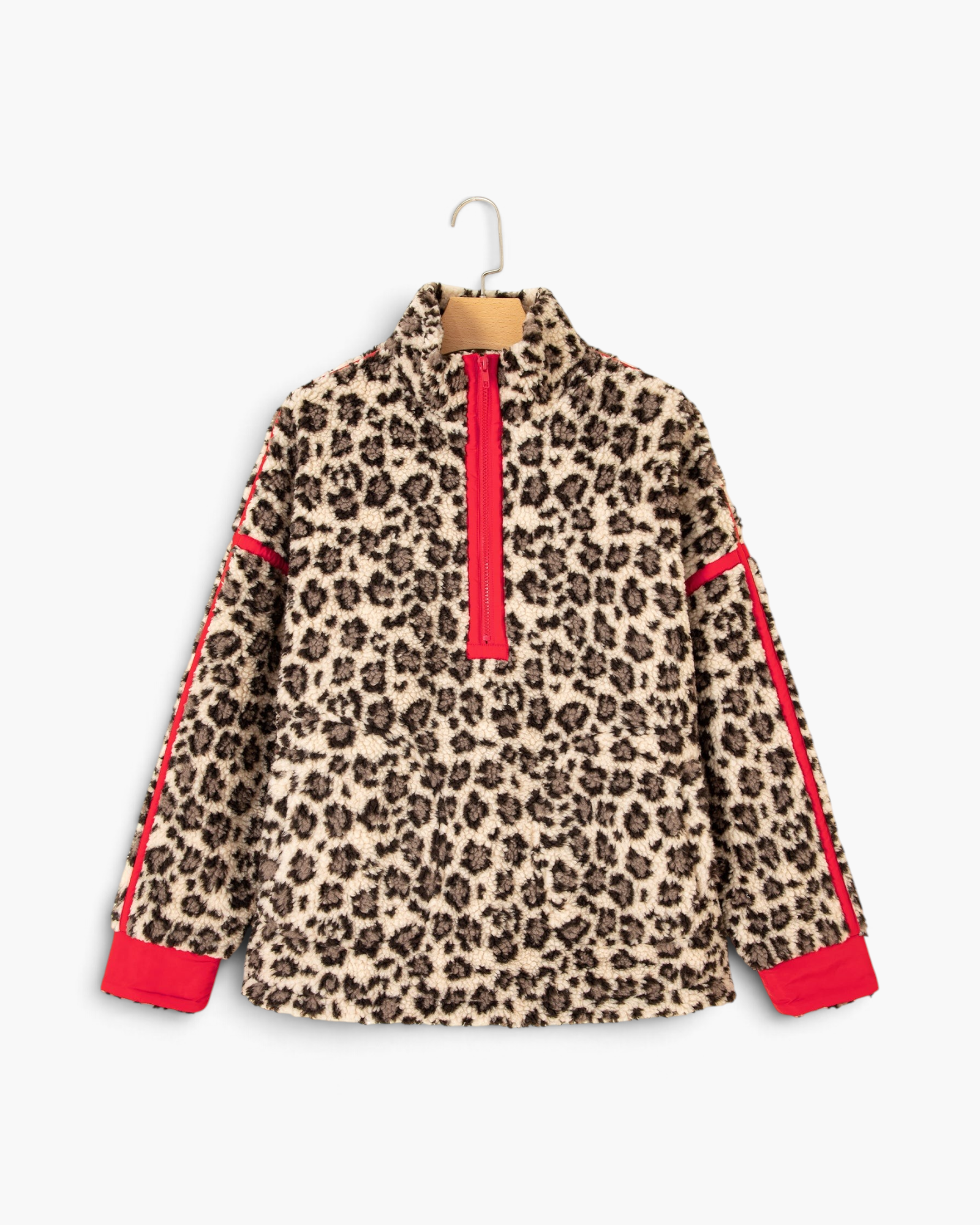 Beach Rose Co. cream leopard print sherpa half-zip pullover with bold red trim on sleeves and collar
