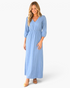 Beach Rose Co. light blue cotton maxi dress with V-neck, puff sleeves, and gathered waist worn by a blonde model