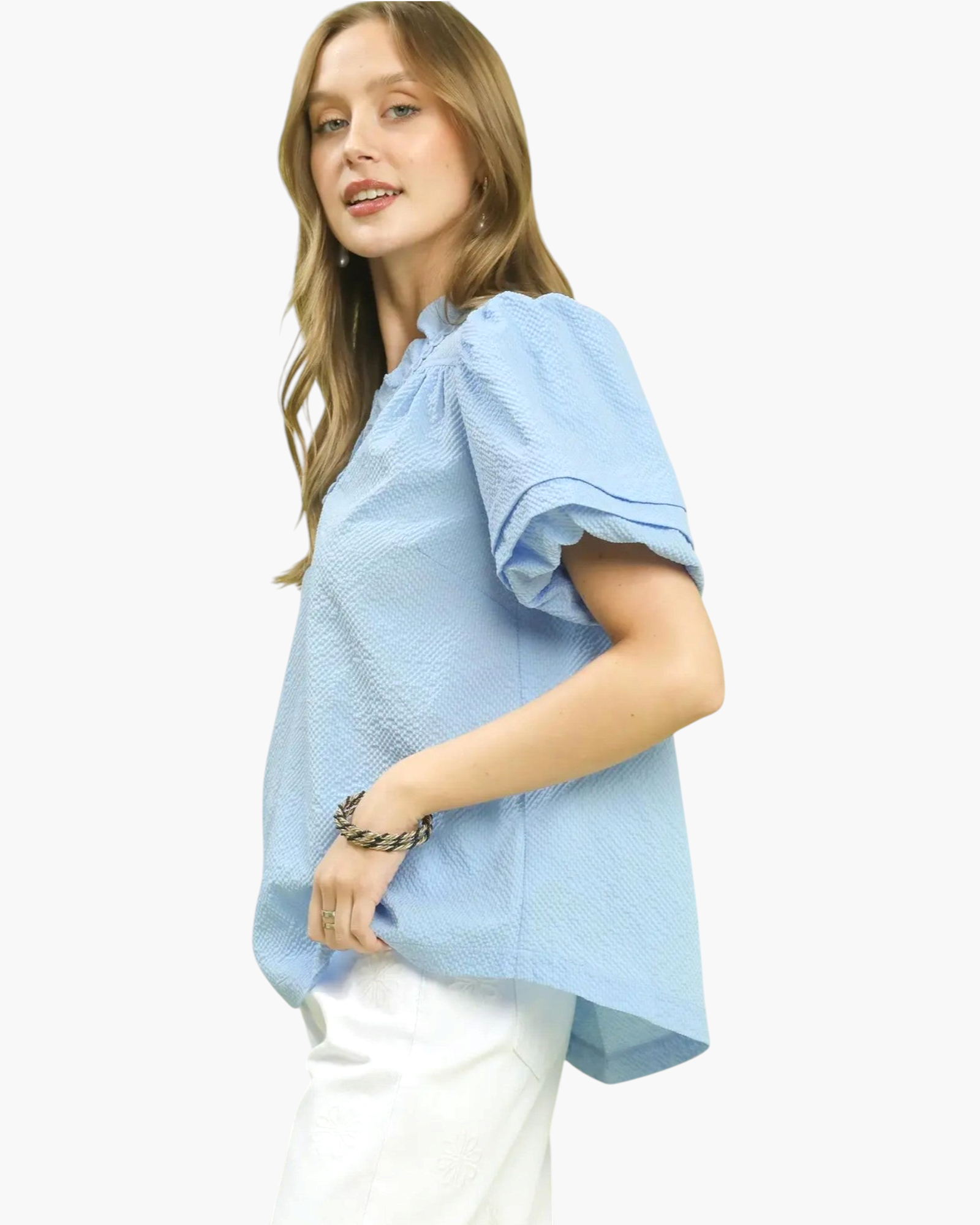 Beach Rose Co. light blue textured blouse with ruffled stand collar and short puff sleeves worn by a model.