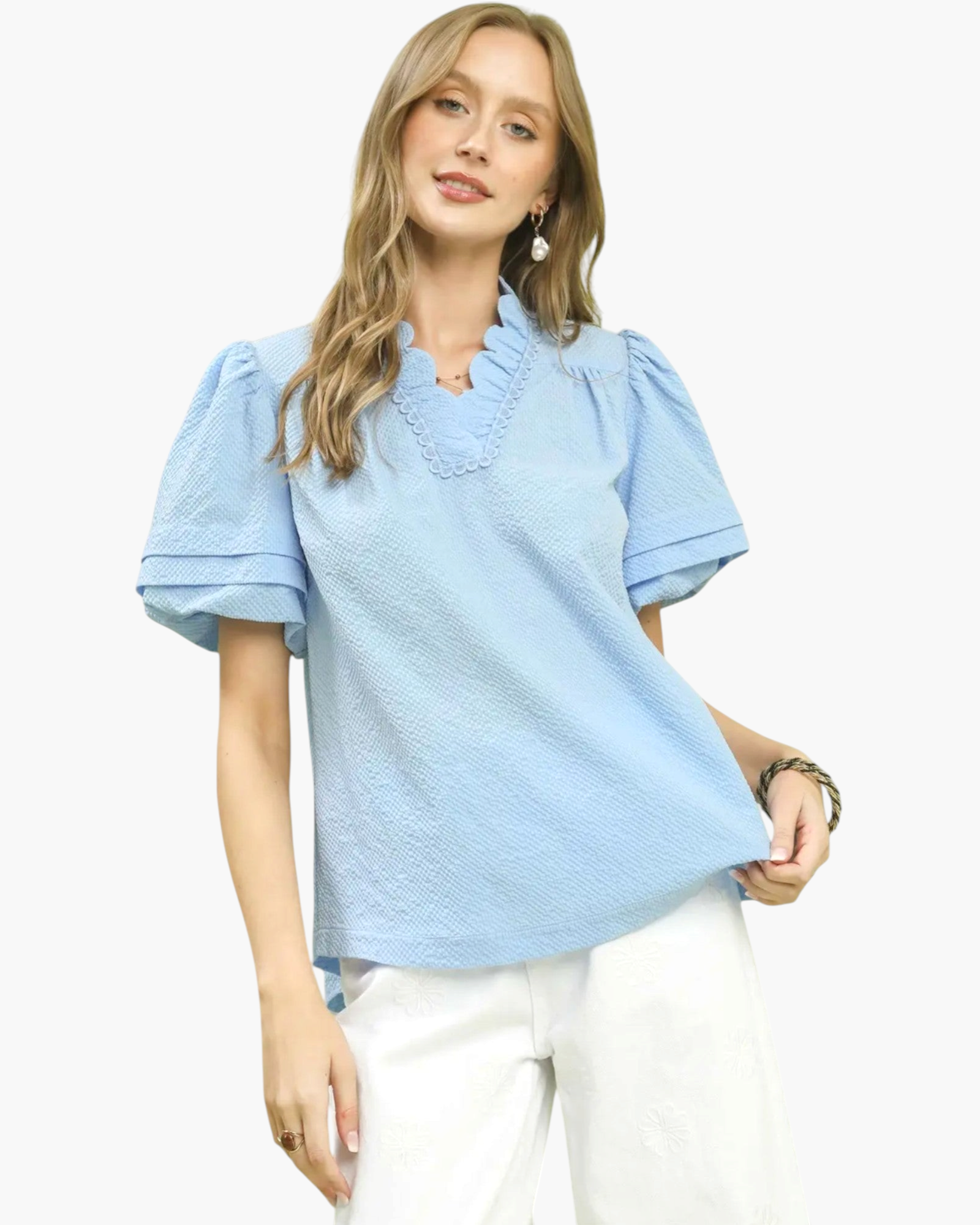 Beach Rose Co. light blue textured blouse with a ruffled stand collar, V-neck, and short puff sleeves on a model.