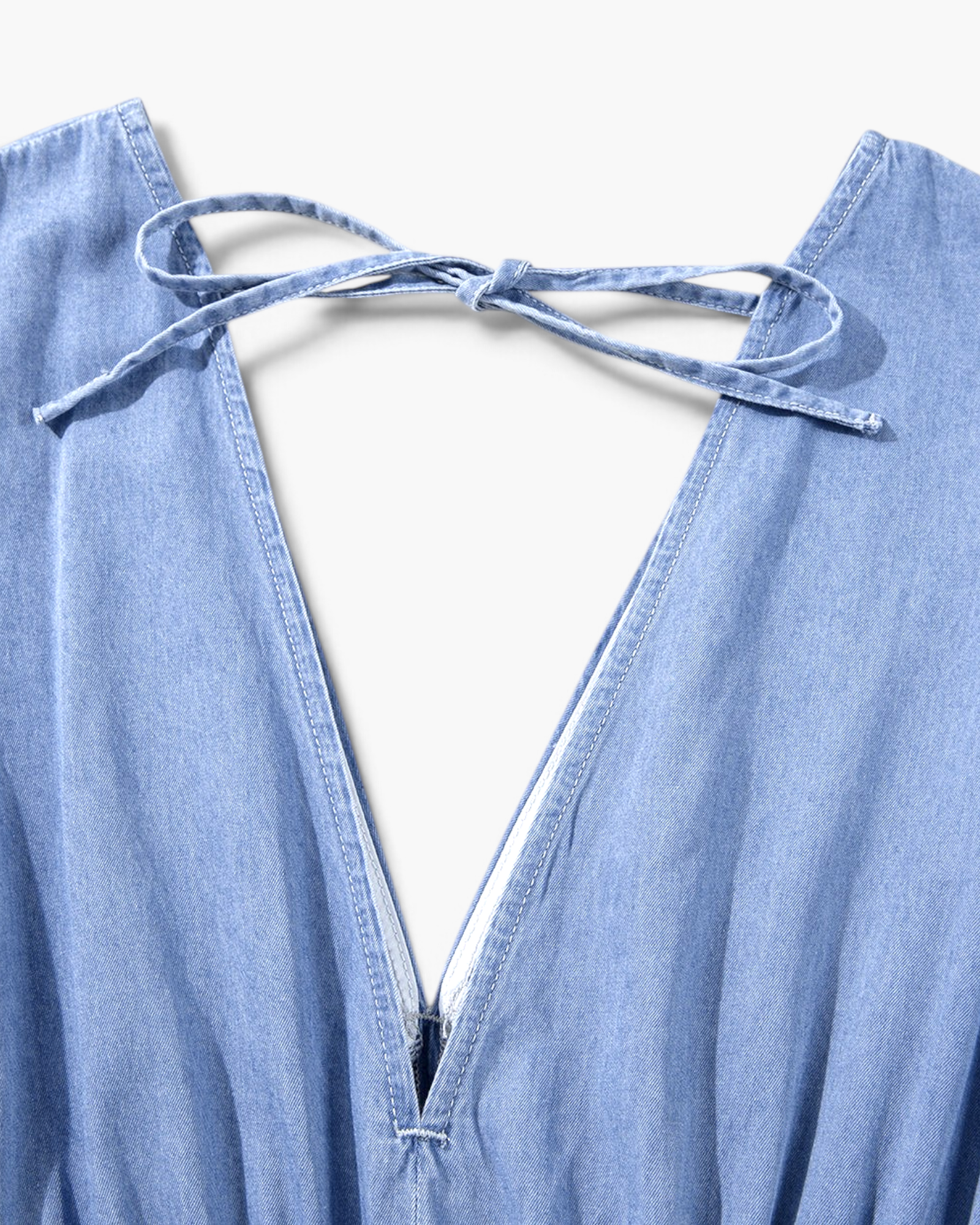 Beach Rose Co. light blue cotton maxi dress featuring a deep V-back with a delicate tie detail