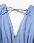 Beach Rose Co. light blue cotton maxi dress featuring a deep V-back with a delicate tie detail