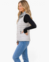 Beach Rose Co. light gray quilted vest with faux-fur collar worn by a blonde woman in a side profile view