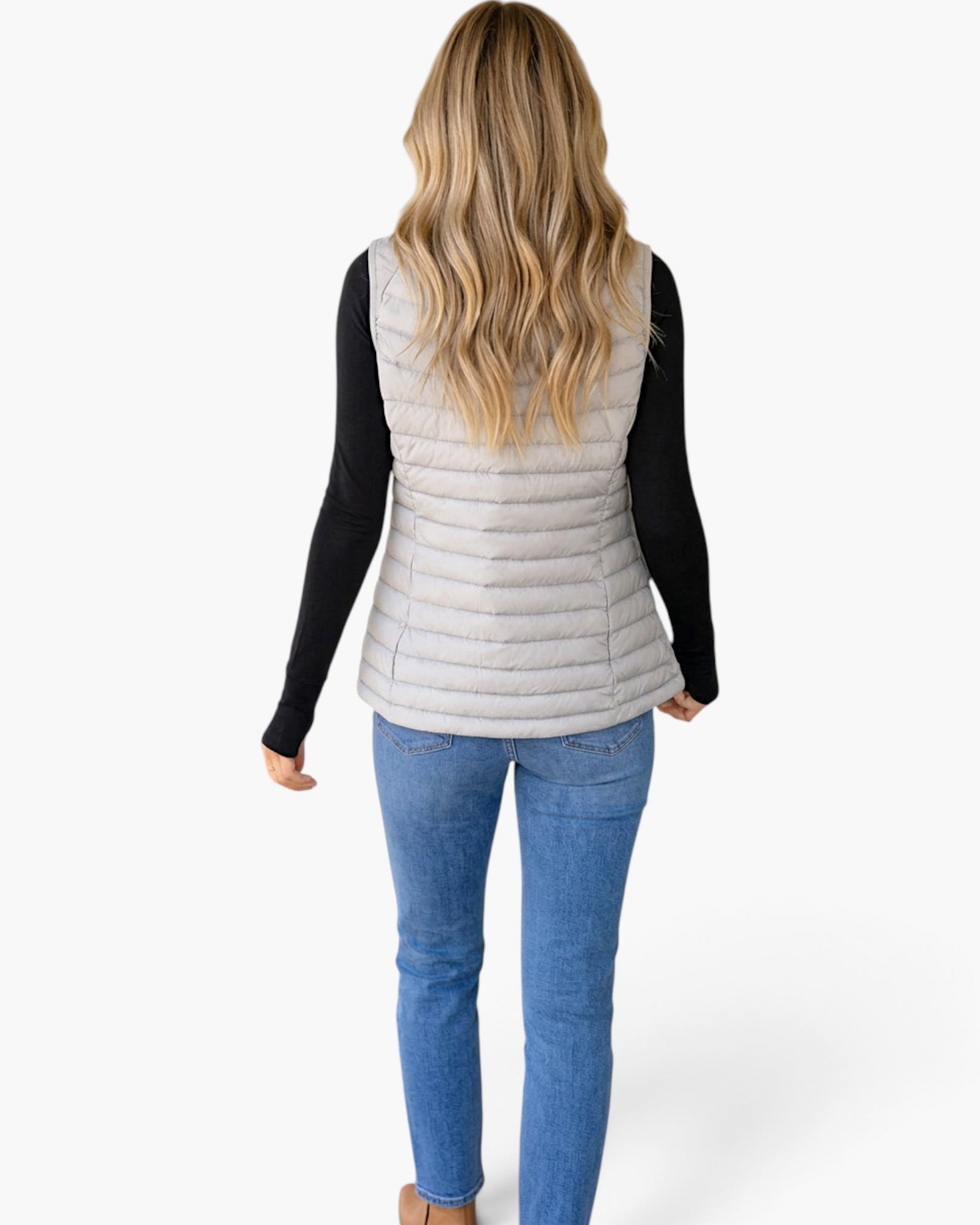 Beach Rose Co. light gray quilted vest with a faux-fur collar worn by a woman with long blonde hair, back view