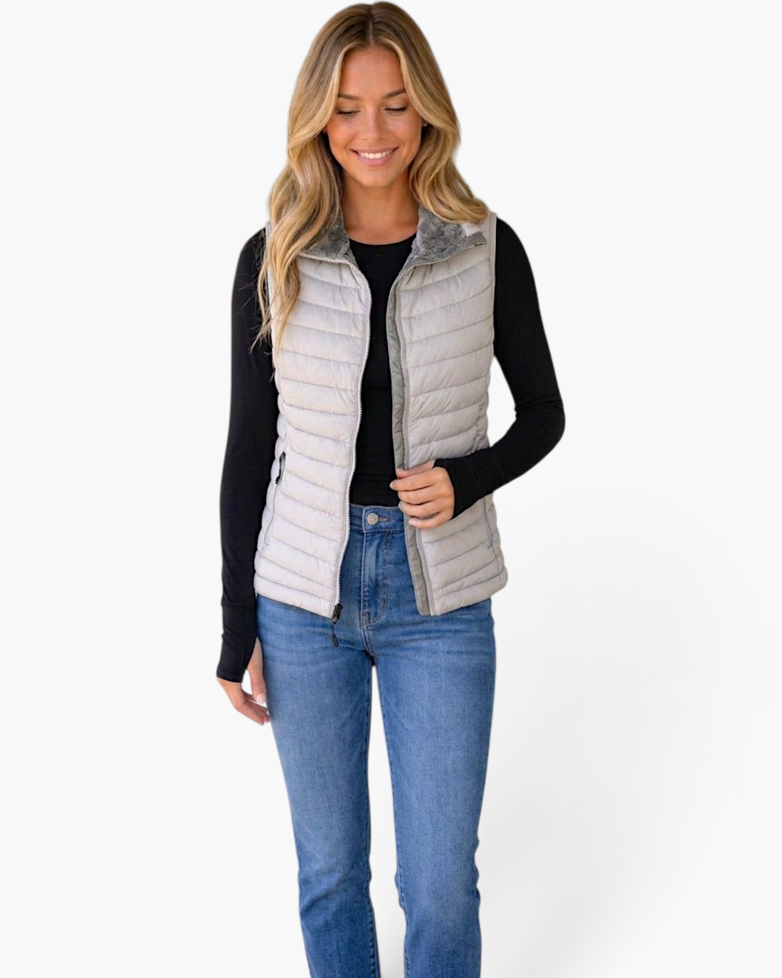 Beach Rose Co. light gray quilted vest with a faux-fur lined collar worn by a smiling woman over a black long-sleeve.