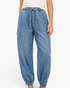 Beach Rose Co. light wash denim joggers with a drawstring waist, relaxed fit, and elastic ankle cuffs.