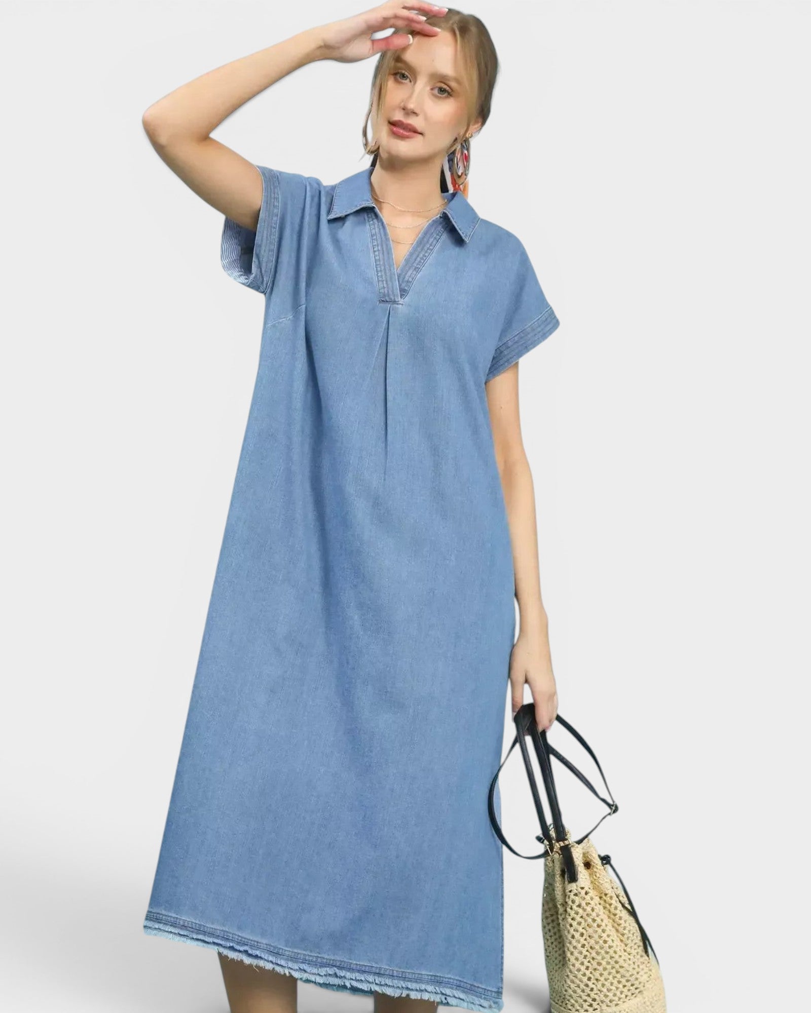 Beach Rose Co. light wash denim midi dress with collared neckline, short sleeves, and frayed hem. Cotton-blend fabric.