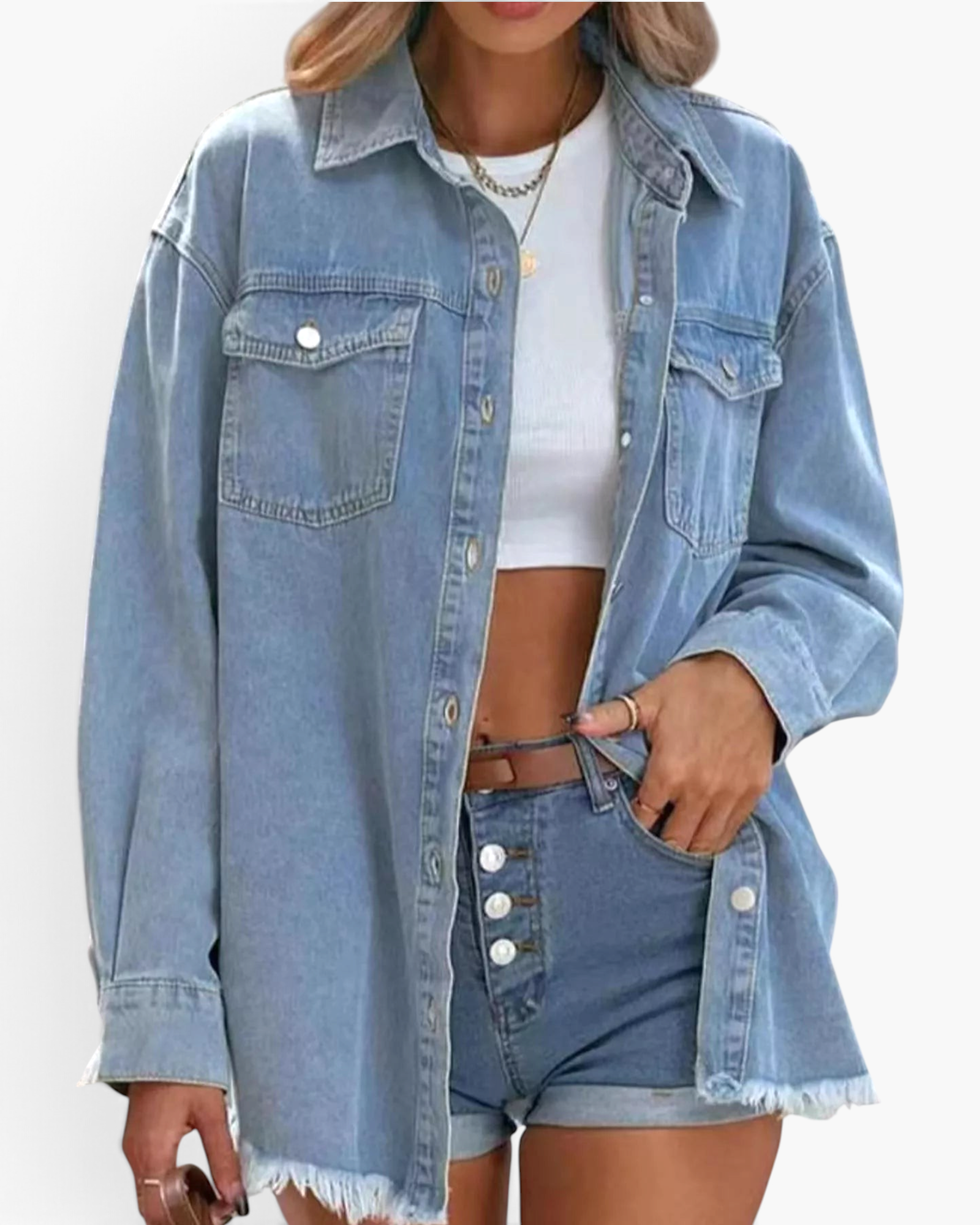 Beach Rose Co. light wash denim shirt with chest pockets, pointed collar, and frayed hem worn over a white crop top.