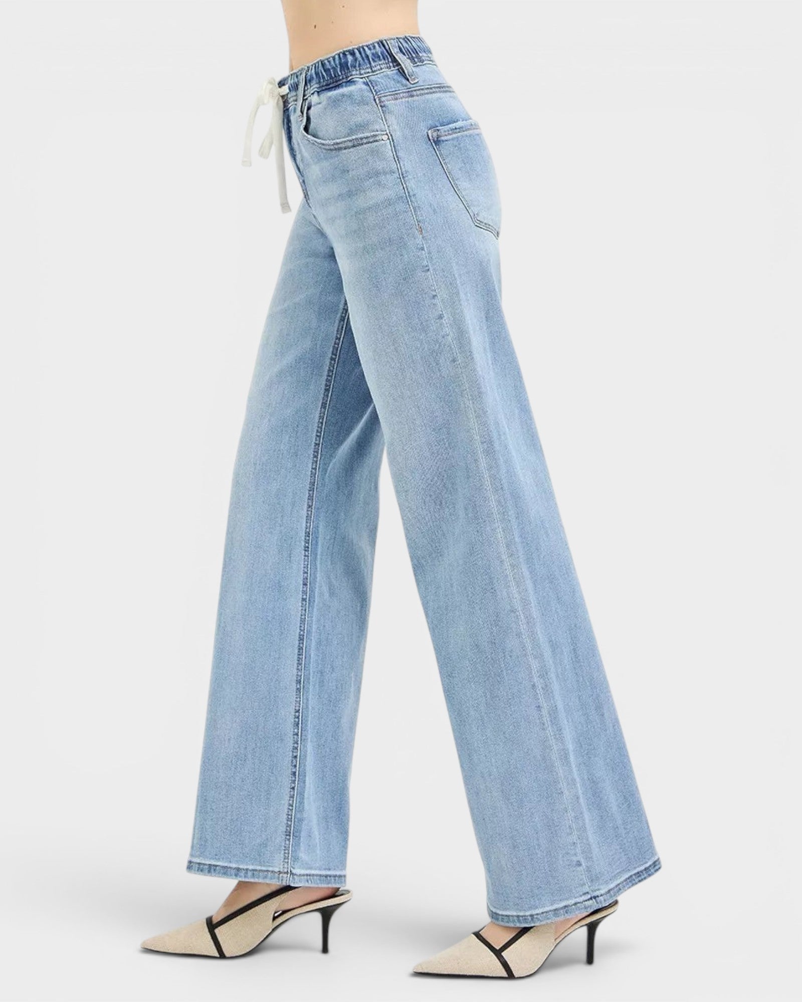 Beach Rose Co. light wash denim wide leg jeans with drawstring waist and pockets. Relaxed fit, casual style.