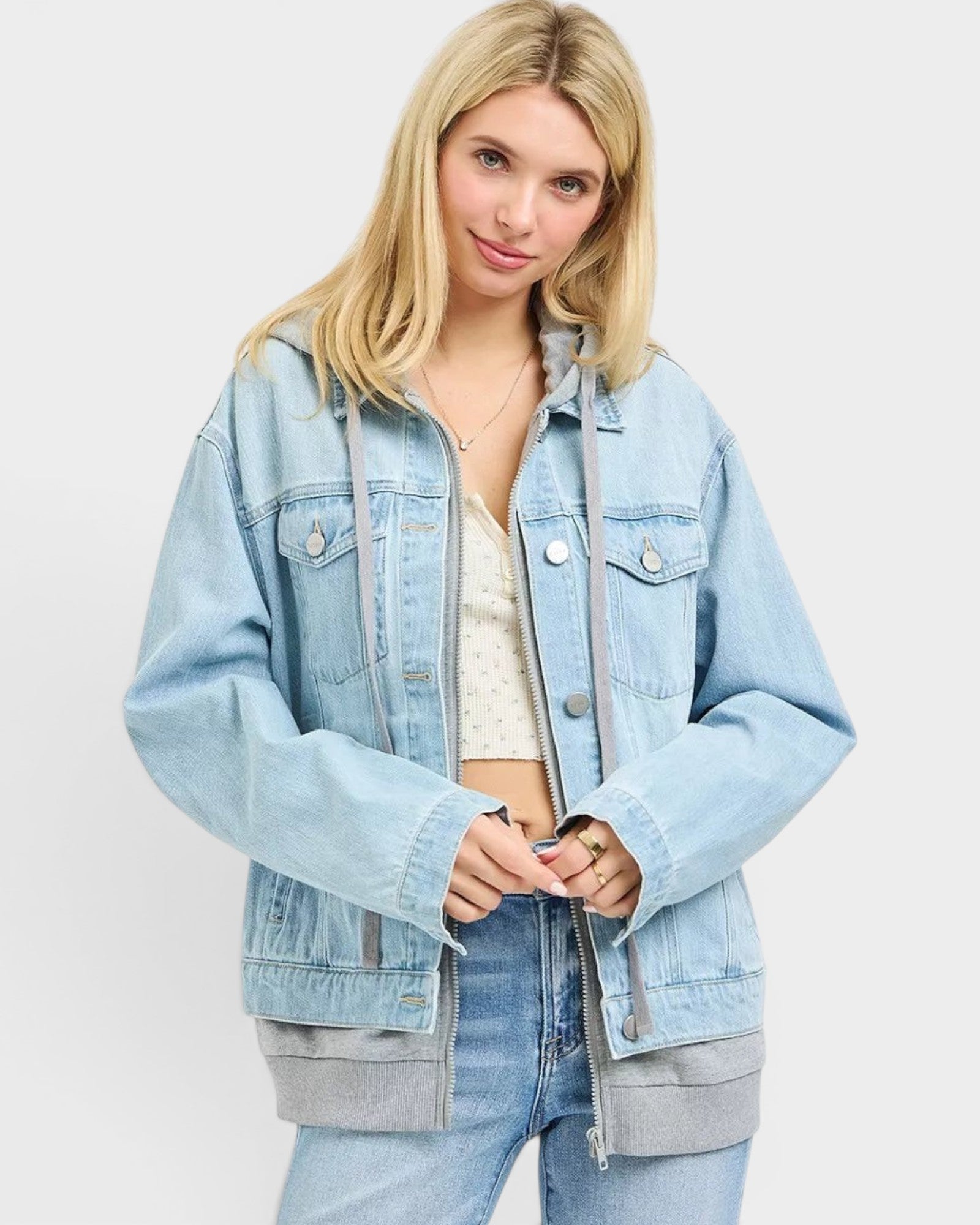 Beach Rose Co. light wash denim jacket with gray hood and ribbed hem, zip front, chest pockets, relaxed fit.