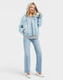 Beach Rose Co. light wash denim jacket with gray hood and ribbed hem, zip front, chest pockets, relaxed fit.