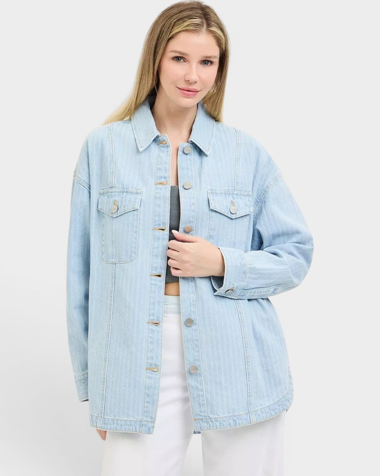 Beach Rose Co. light wash denim jacket with subtle vertical stripes, collared neckline, button front, and chest pockets. Relaxed fit.