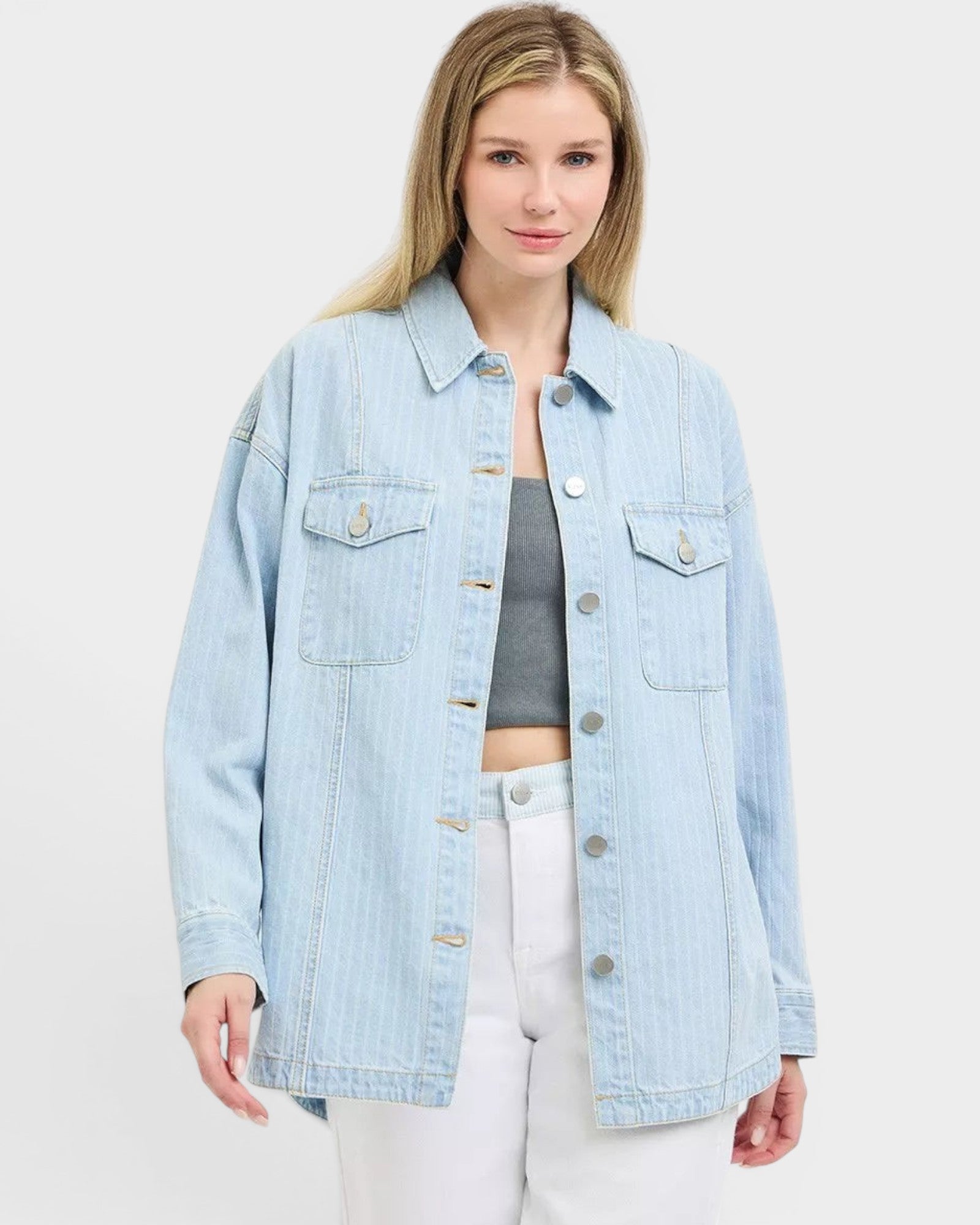 Beach Rose Co. light wash denim jacket with subtle vertical stripes, collared neckline, button front, and chest pockets. 100% cotton.