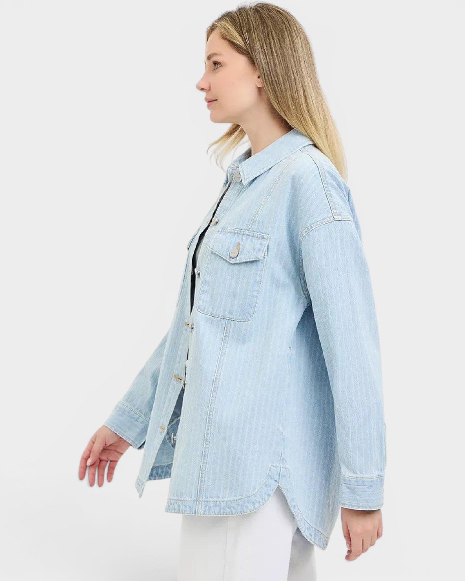 Beach Rose Co. light wash denim jacket with subtle vertical stripes, collared neckline, button front, and chest pockets.