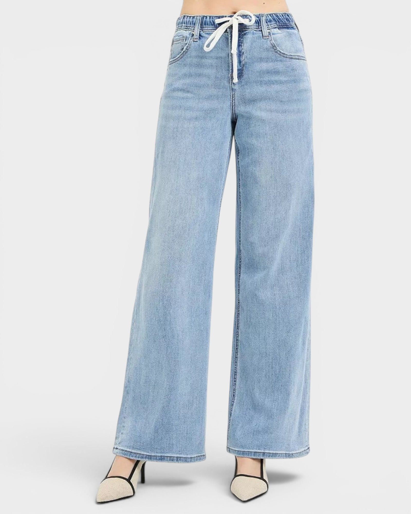 Beach Rose Co. light wash denim wide leg jeans with elastic waistband and white drawstring, pocketed.