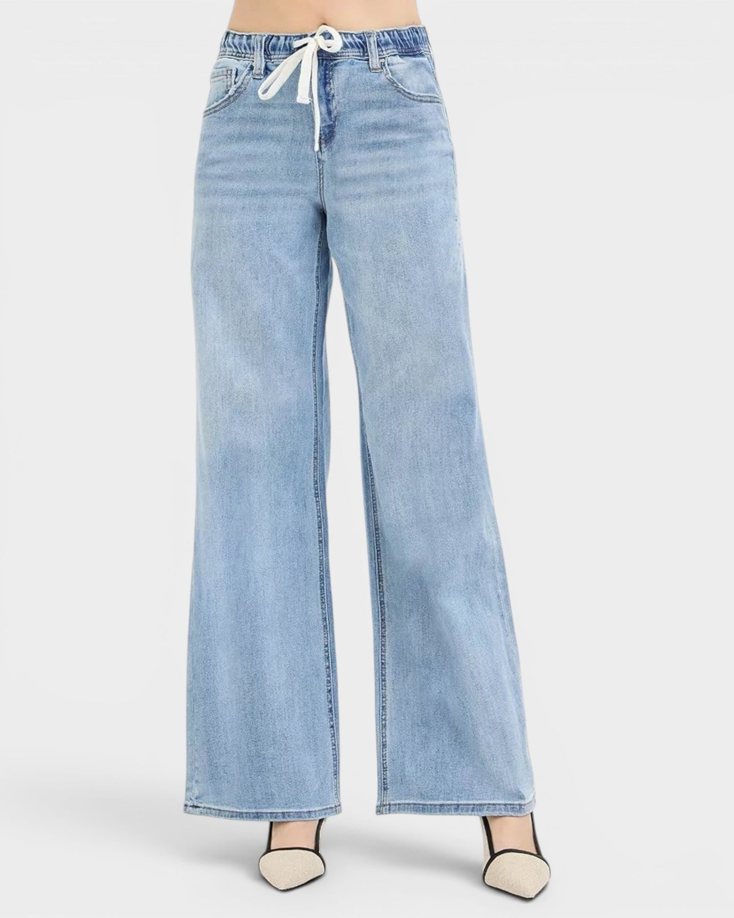 Beach Rose Co. light wash denim wide leg jeans with drawstring waist and pockets. Relaxed fit, casual street style.