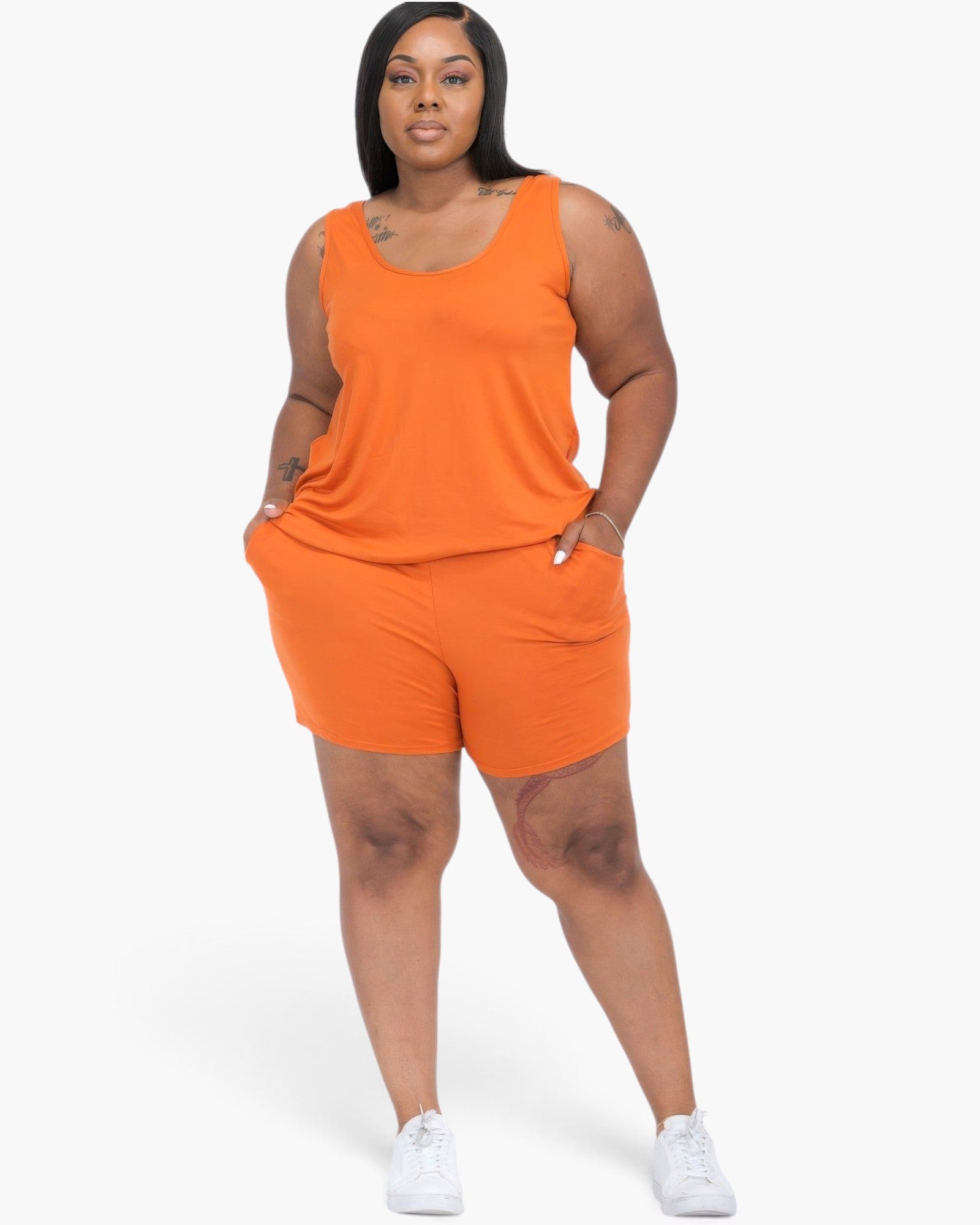 Beach Rose Co. plus size mango orange tank top and shorts lounge set on a model with white sneakers