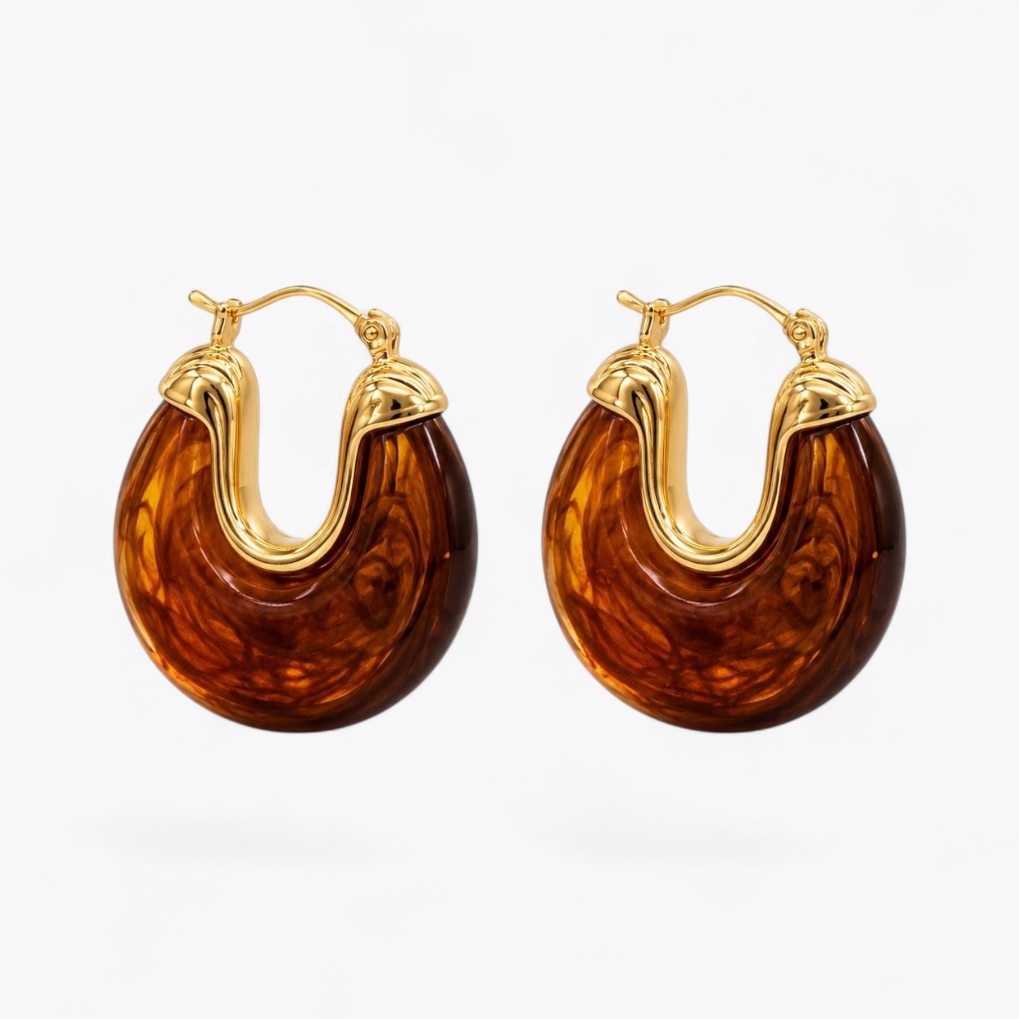 Beach Rose Co. marbled brown resin hoop earrings with polished 18K gold filled metal accents and hinged closures.