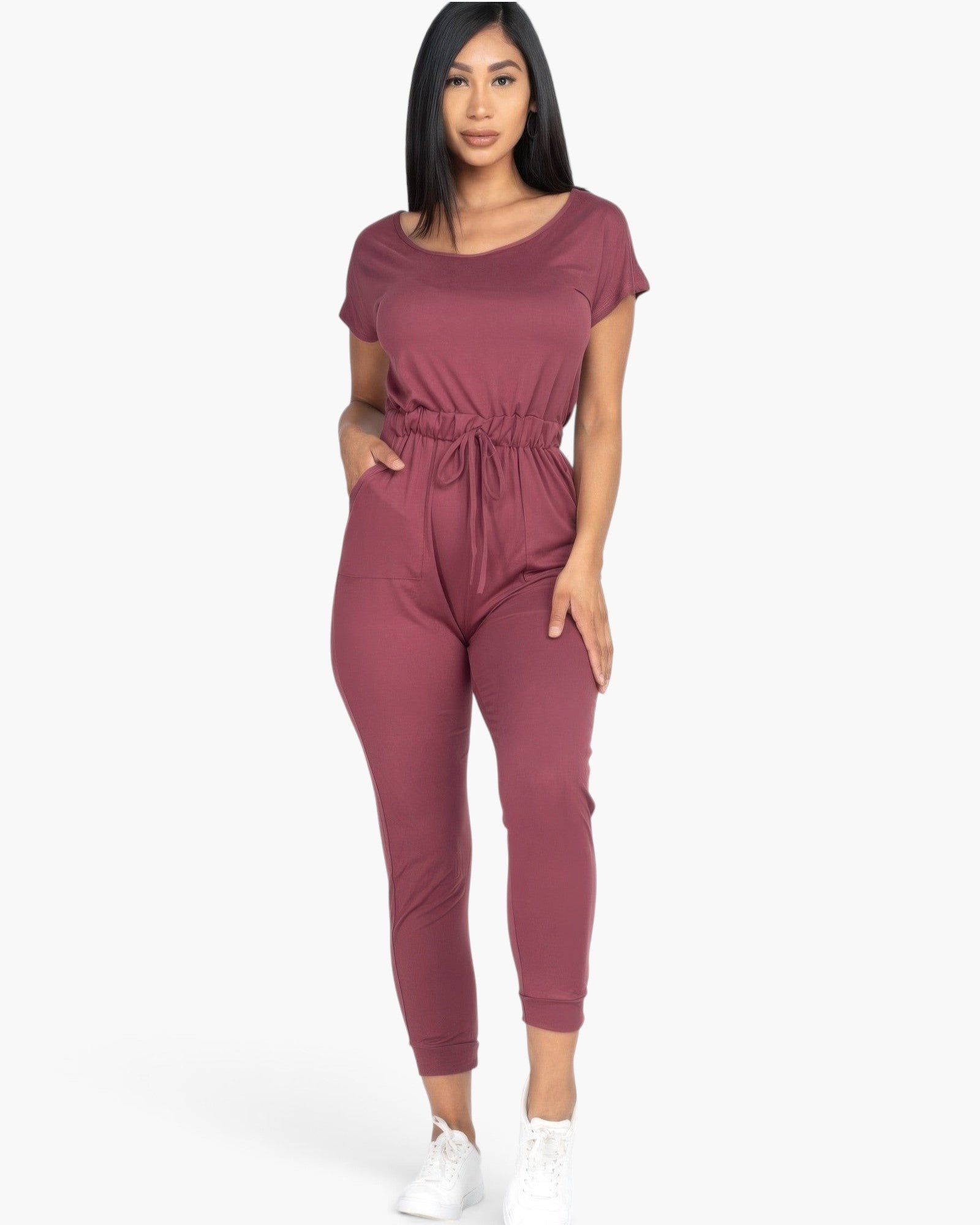 Beach Rose Co. woman wearing a mauve two-way shoulder drawstring jumpsuit in soft stretch jersey with tapered legs.