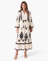 Beach Rose Co. cream maxi dress with black medallion print, button-front bodice, and tiered skirt on a model.