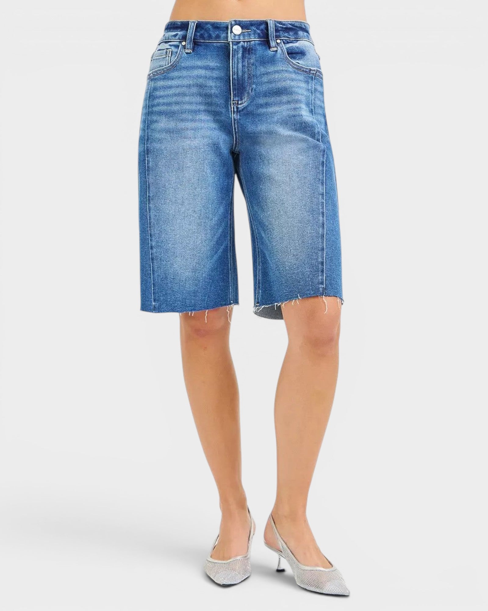 Beach Rose Co. medium wash denim Bermuda shorts with raw hem, five-pocket styling, and stretch fabric.