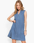 Beach Rose Co. medium wash denim sleeveless A-line dress with split neckline and side pockets on a blonde model