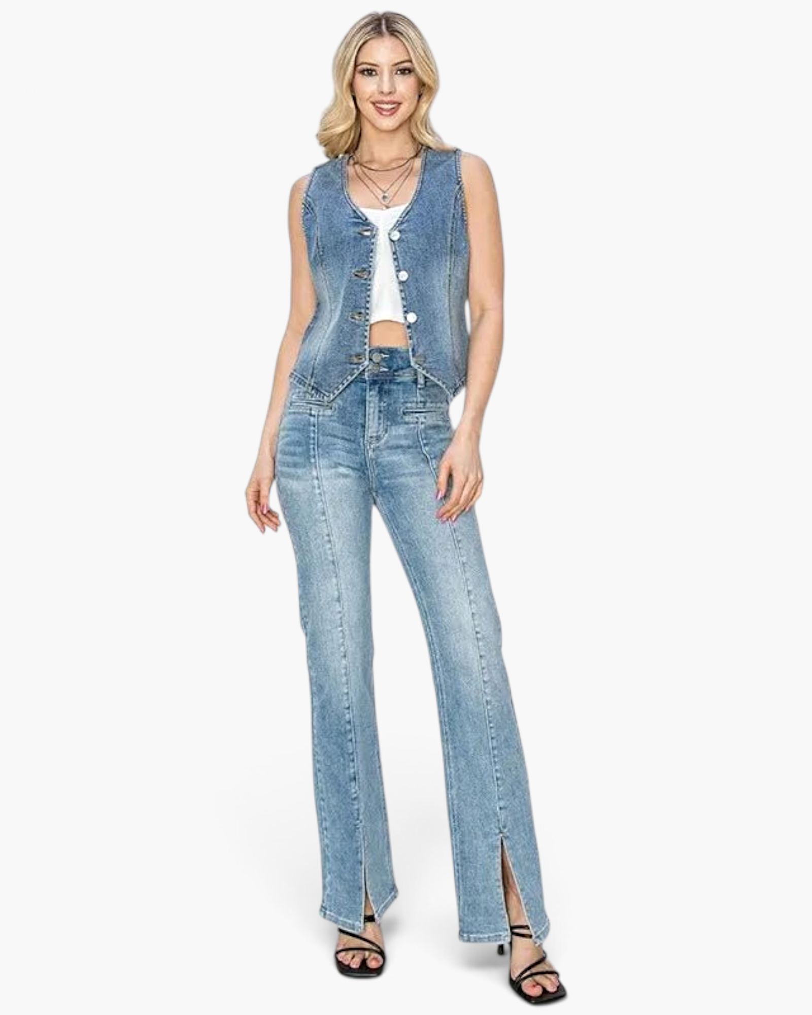 Beach Rose Co. medium wash denim vest with V-neck and silver buttons worn by a model with matching split-hem jeans.