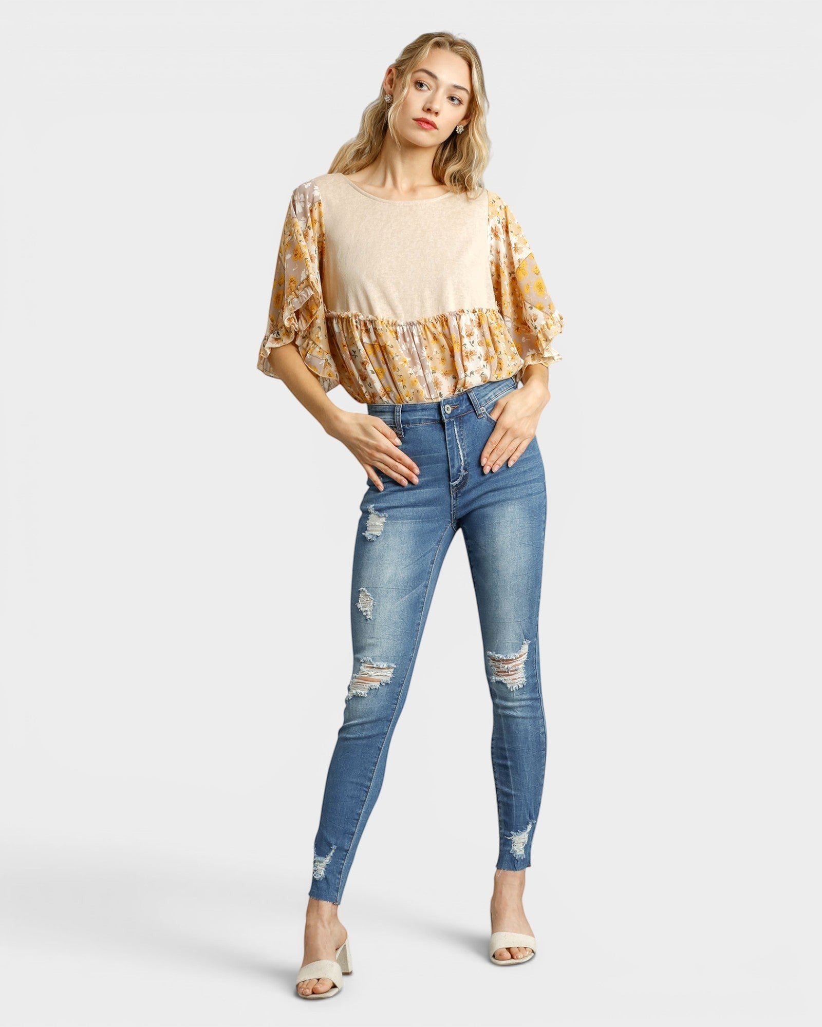 Beach Rose Co. medium wash skinny jeans with distressed details and raw ankle hem. Made of 95% cotton, 5% spandex.