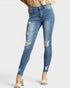Beach Rose Co. medium wash skinny jeans with distressed details and raw ankle hem, made from cotton and spandex blend.