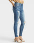 Beach Rose Co. medium wash skinny jeans with distressed details and raw ankle hem, made from cotton and spandex blend.