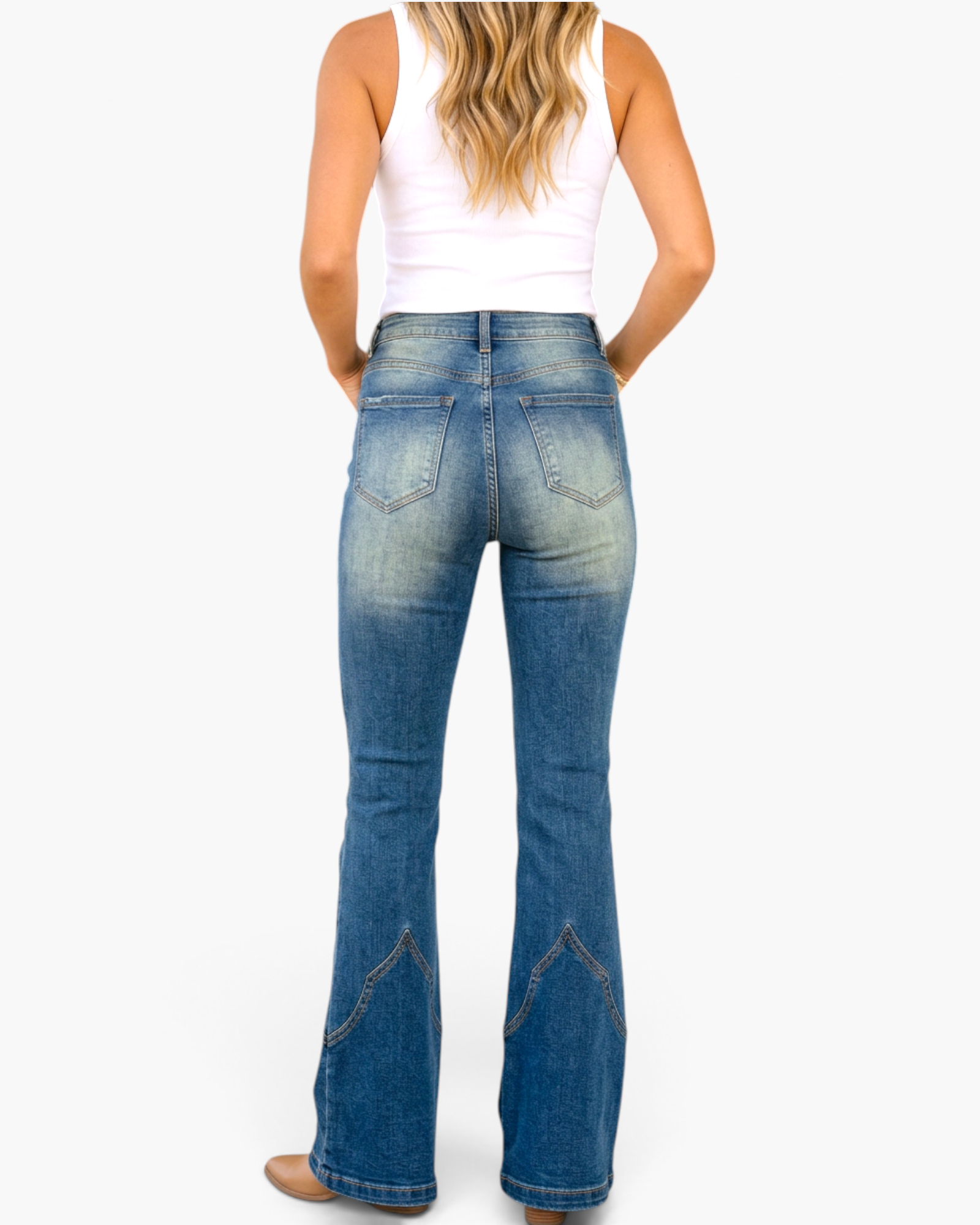 Beach Rose Co. medium wash high-rise flare jeans with Western-inspired pointed contrast seaming on the lower legs.
