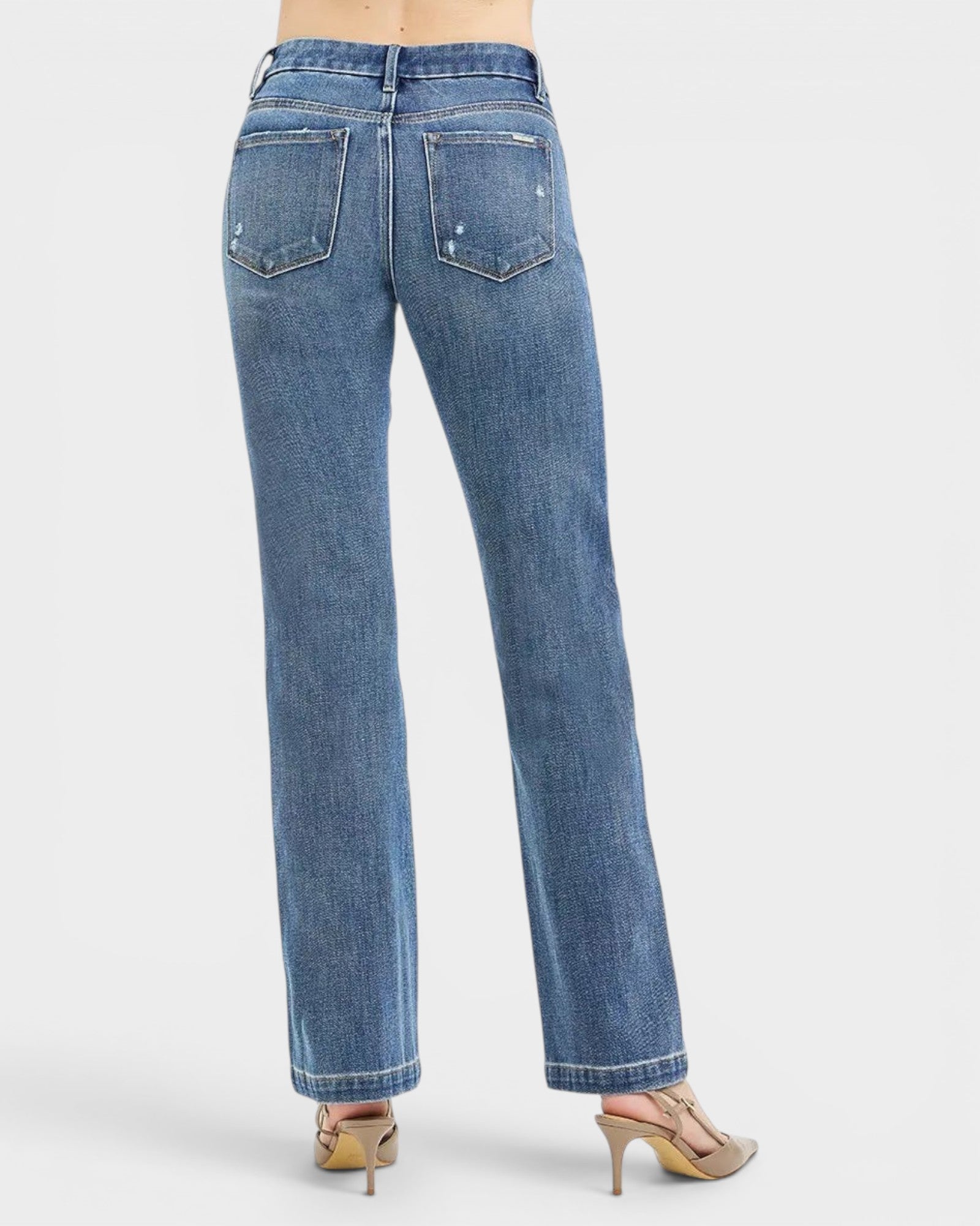 Beach Rose Co. Medium wash straight leg jeans with tummy control, made from cotton blend with 4-way stretch. Features pockets and zipper.