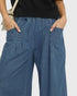 Beach Rose Co. medium wash denim wide leg jeans with elastic waist, pockets, and raw hem.