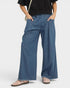 Beach Rose Co. medium wash denim wide leg jeans with raw hem and elastic waist.