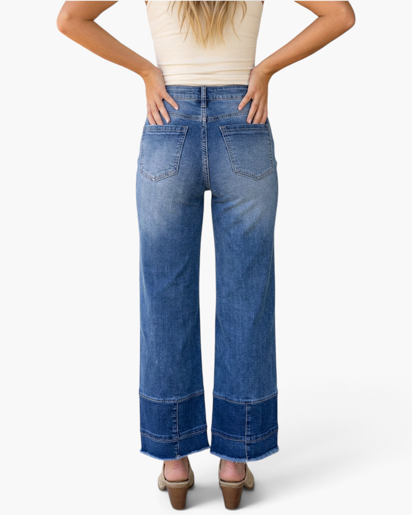 Beach Rose Co. medium wash high-rise wide-leg jeans with seamed cuffs and raw hems, back view on a model.