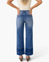 Beach Rose Co. medium wash high-rise wide-leg jeans with seamed cuffs and raw hems, back view on a model.