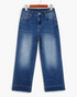 Beach Rose Co. medium wash high-rise wide-leg jeans with seamed cuffs and raw hems on a wooden hanger.