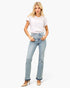 Beach Rose Co. mid-rise flare jeans with a released raw hem worn by a blonde model with a white t-shirt and heels.