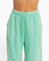 Beach Rose Co. mint green acid wash French terry wide-leg pants with a high-rise drawstring waist and center seams.