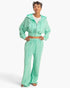 Beach Rose Co. model wearing mint green acid wash French terry wide-leg pants with a matching cropped zip-up hoodie.