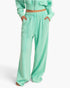 Beach Rose Co. mint green acid wash French terry wide-leg pants with a high-rise drawstring waist and center seams.