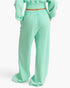 Beach Rose Co. mint green acid wash French terry wide-leg pants with a high-rise elastic waistband, back view.